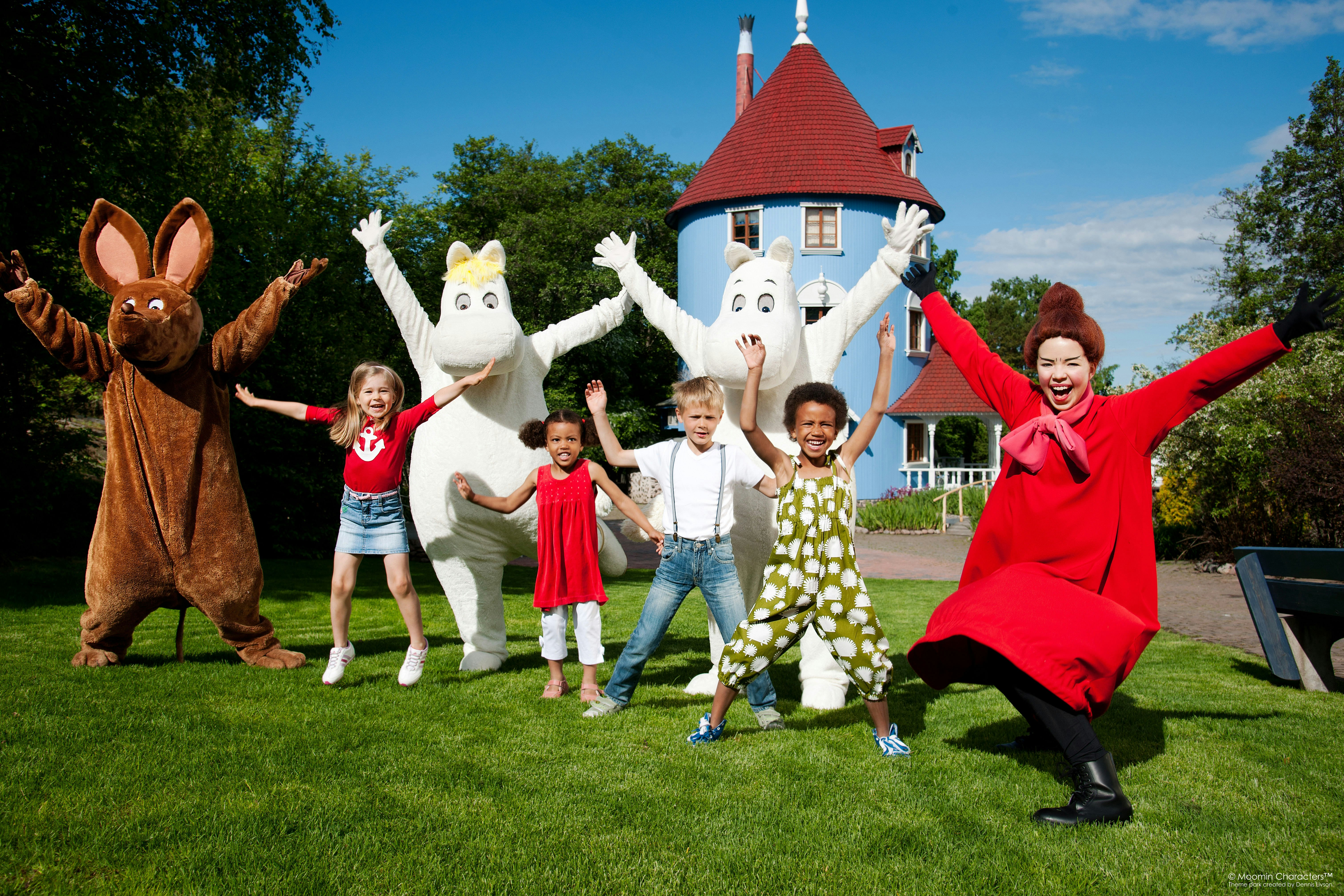 All the moomins with their guests at Moominworld